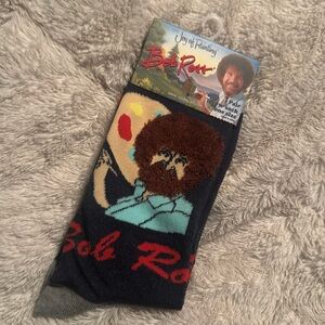Bob Ross is truly missed. Multi-color socks featuring Bobs iconic Afro.